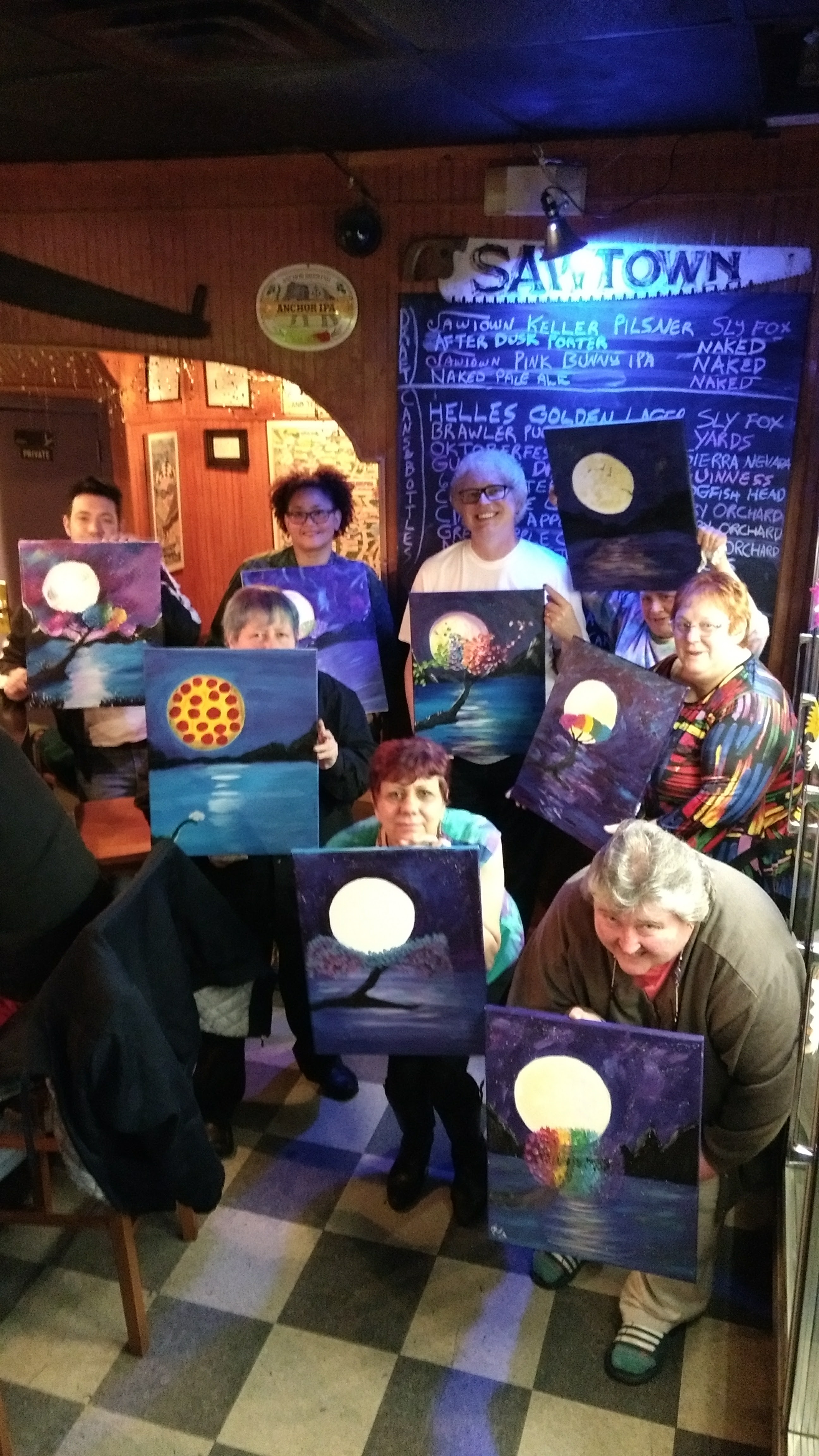 Guests painting at a Devine Art Parties event